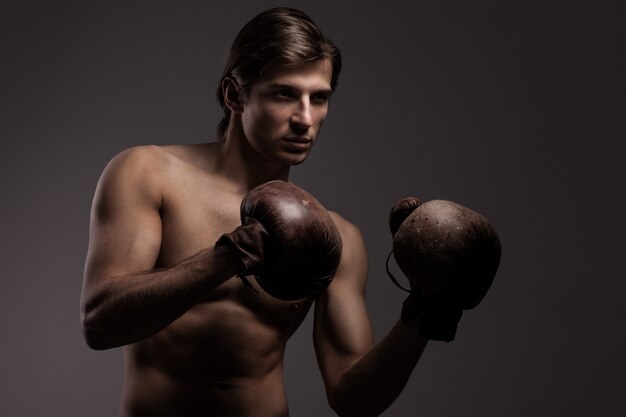 Handsome guy in a boxing gloves