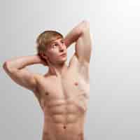 Free photo handsome guy posing with naked torso