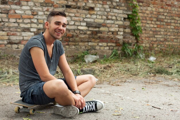 Handsome guy sitting in the street