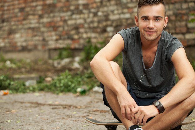 Handsome guy sitting in the street