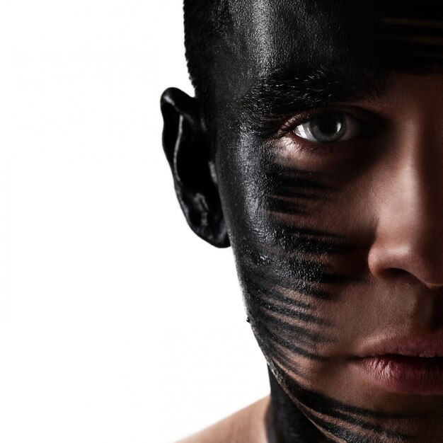 Handsome guy with artistic black shadow on his face 