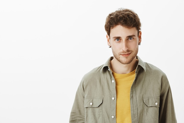 Handsome happy man posing in the studio