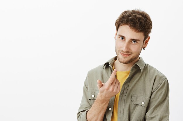 Handsome happy man posing in the studio