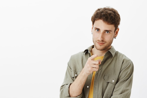 Handsome happy man posing in the studio