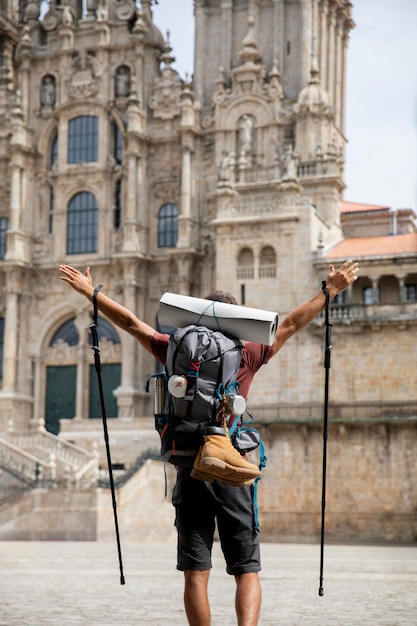 Handsome male traveler at a historical cathedral