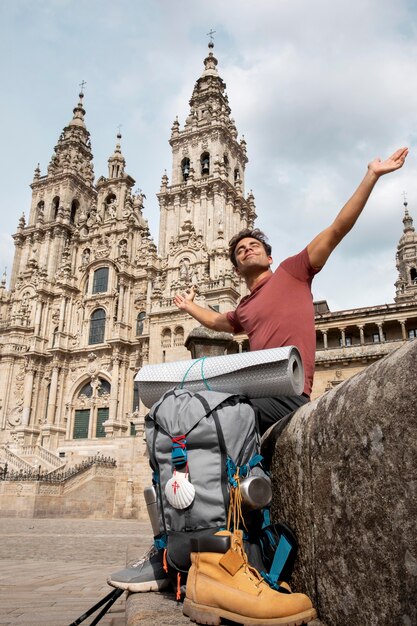 Handsome male traveler at a historical cathedral