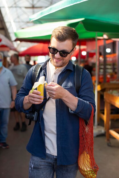 Handsome male traveler in a local outdoor place