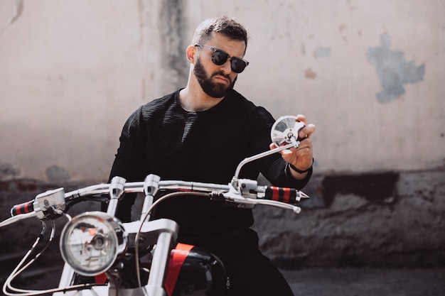 Handsome man biker travelling on mototrcycle