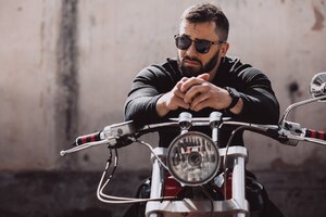 Handsome man biker travelling on mototrcycle