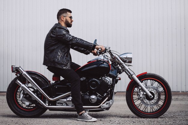 Handsome man biker travelling on mototrcycle