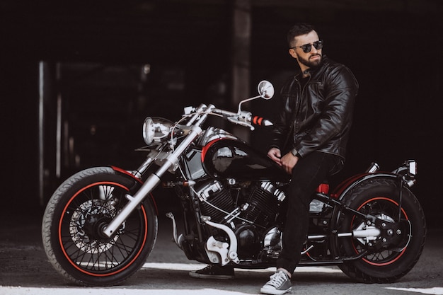 Handsome man biker travelling on mototrcycle