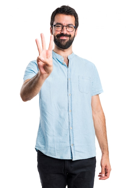 Free photo handsome man counting three