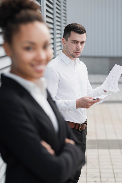 Handsome man next to defocused woman