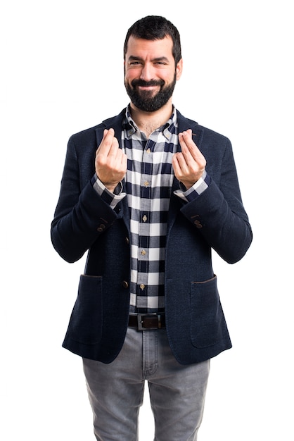 Handsome man doing a money gesture