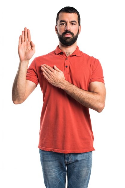 Handsome man doing oath