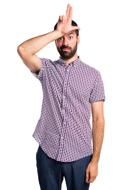 Handsome man doing stupid sign