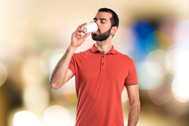 Handsome man drinking coffee