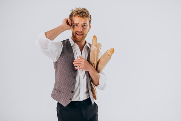 Handsome man eating french baguettes