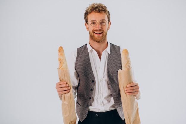 Handsome man eating french baguettes