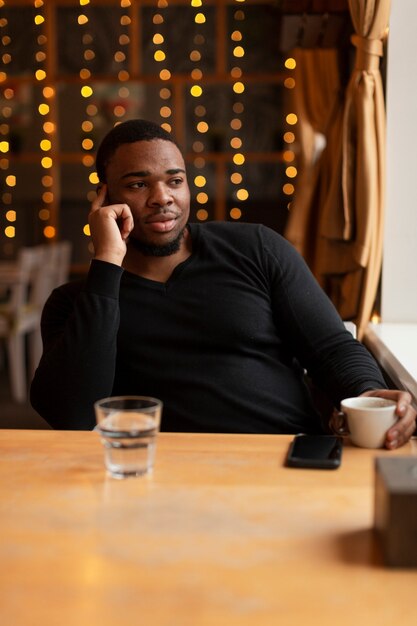 Handsome man enjoying cup of coffee