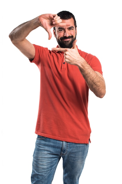 Free photo handsome man focusing with his fingers