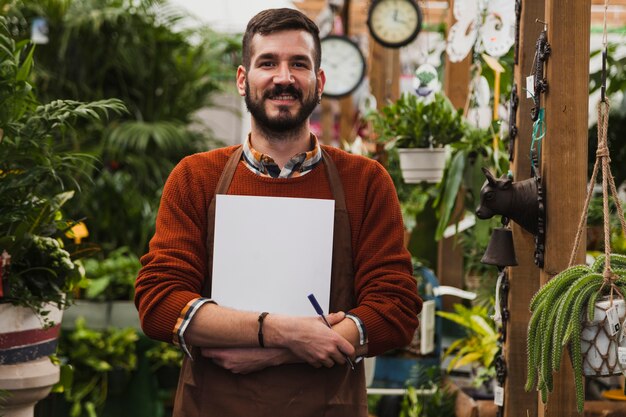 Handsome man in glasshouse