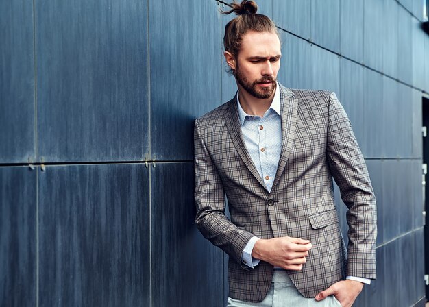 Handsome man in gray checkered suit