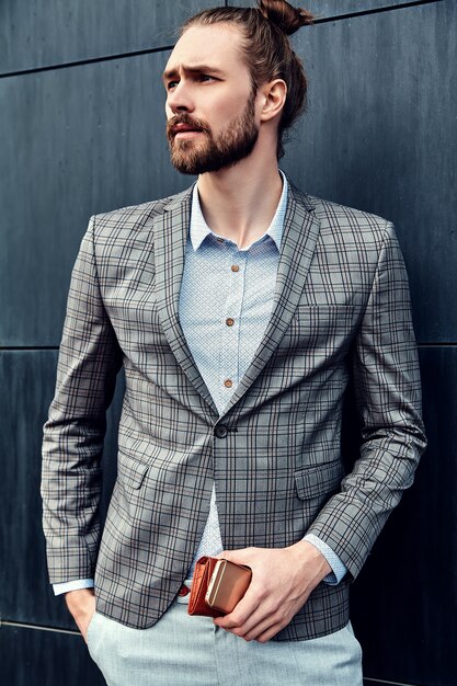 Handsome man in gray checkered suit