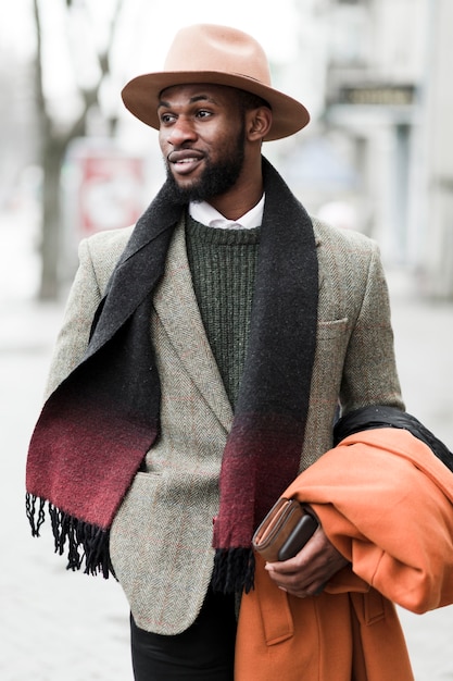 Free photo handsome man in grey jacket posing