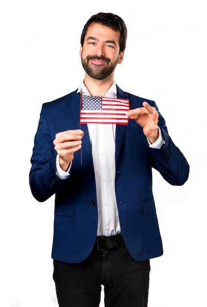 Handsome man holding an american flag