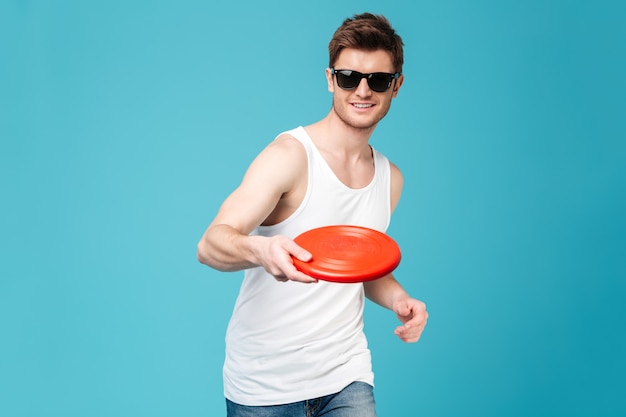 Handsome man holding beach summer toy.