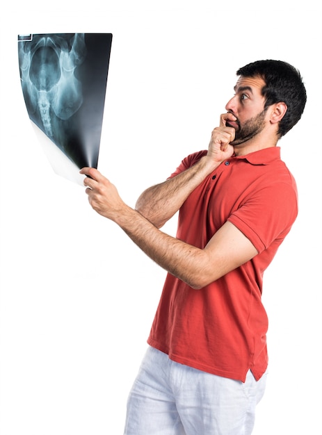 Handsome man holding a bone scan