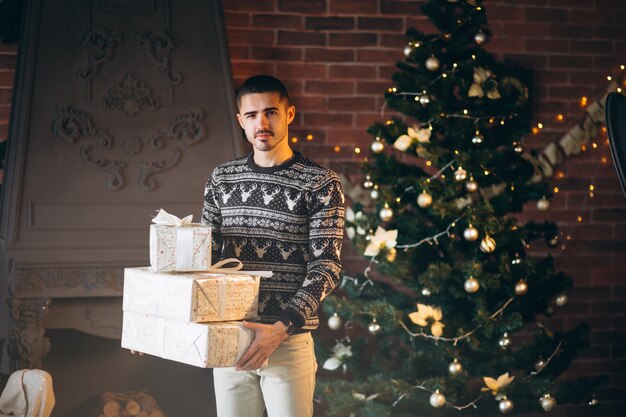 Handsome man holding Christmas peresents