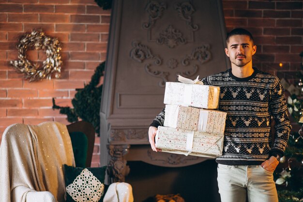 Handsome man holding Christmas peresents