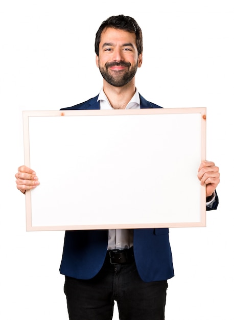 Handsome man holding an empty placard