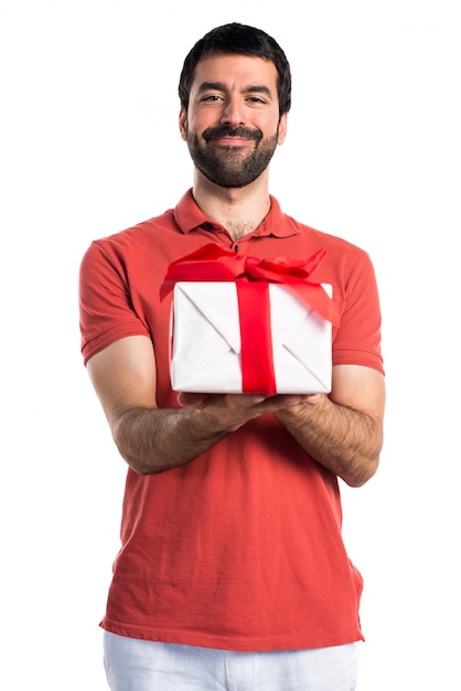 Handsome man holding a gift