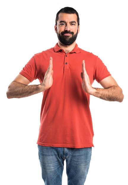 Handsome man holding something