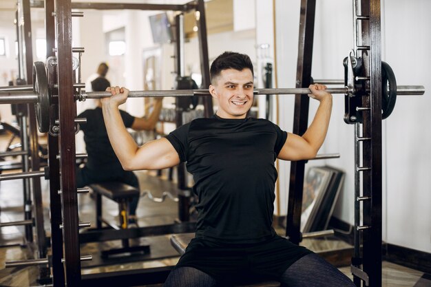 A handsome man is engaged in a gym