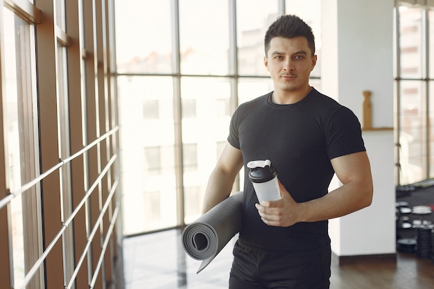 A handsome man is engaged in a gym