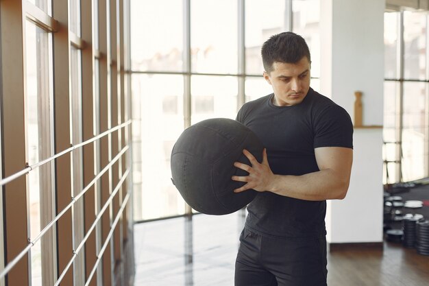 A handsome man is engaged in a gym