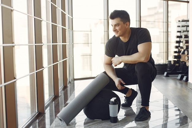 A handsome man is engaged in a gym