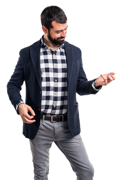 Handsome man making guitar gesture