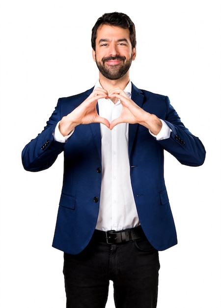 Handsome man making a heart with his hands