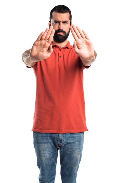 Free photo handsome man making stop sign