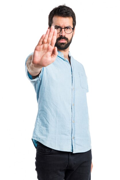 Handsome man making stop sign