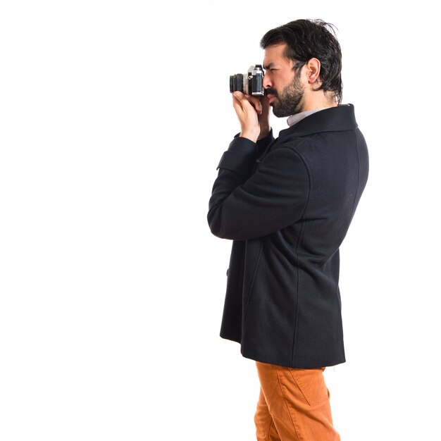 Handsome man photographing something