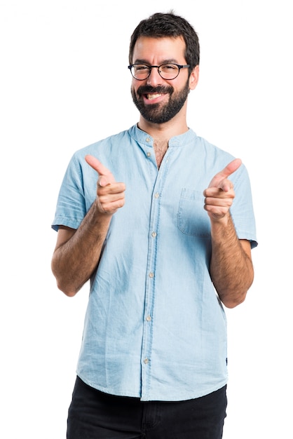 Handsome man pointing to the front