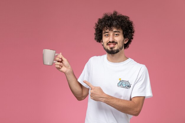 handsome man pointing out his cup