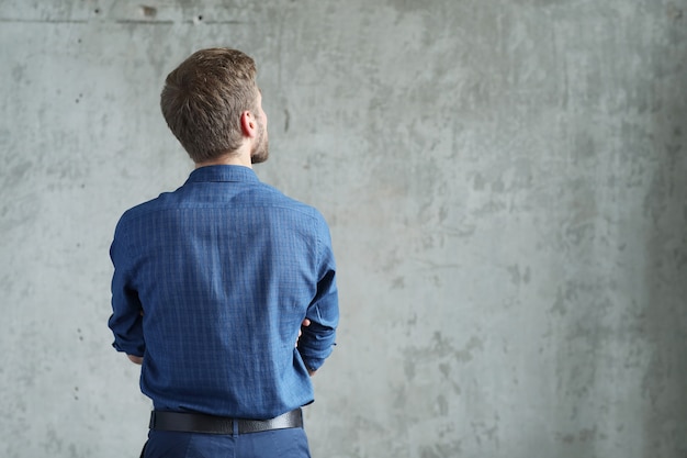 Handsome man posing, back view