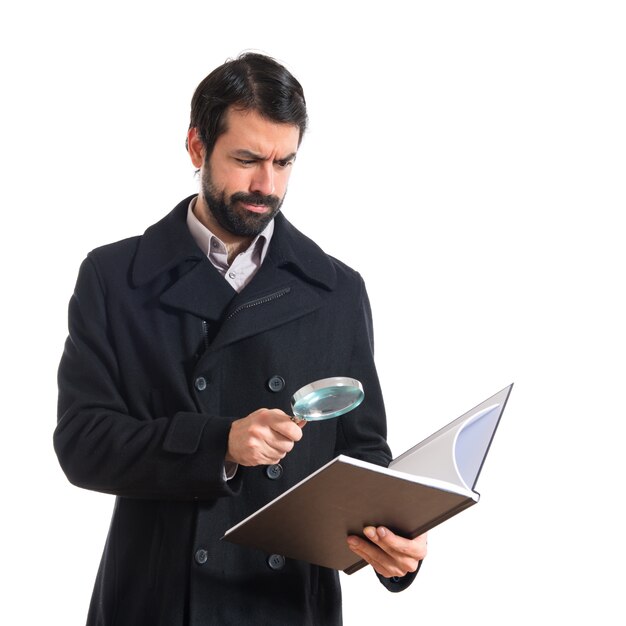 Handsome man reading book